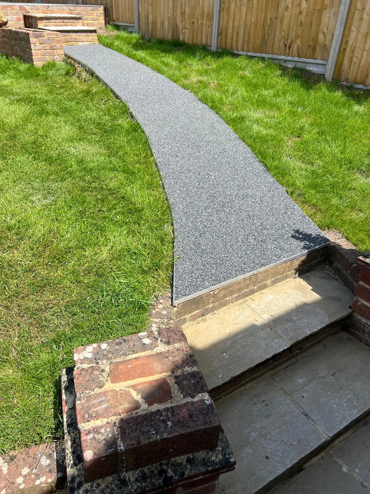 Resin path: Resin-bound path curving across the lawn from the steps.