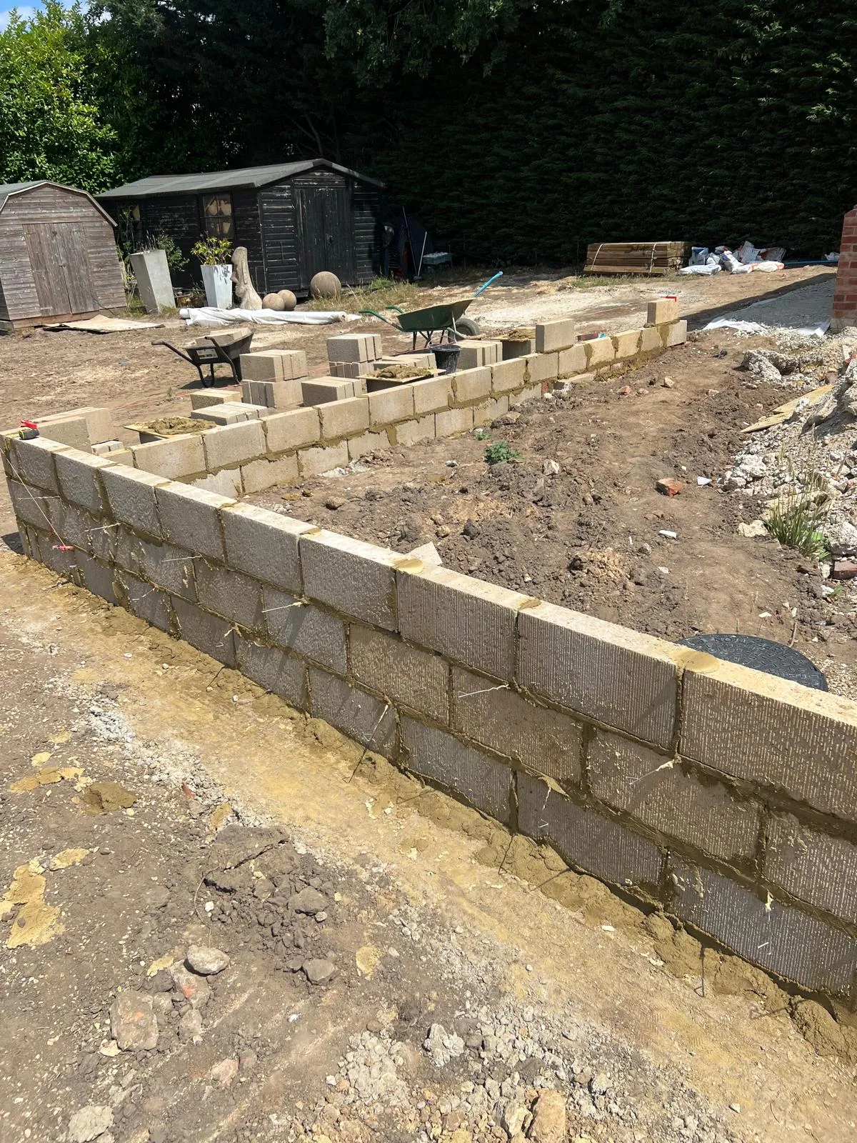 Block wall built up off its concrete footing.