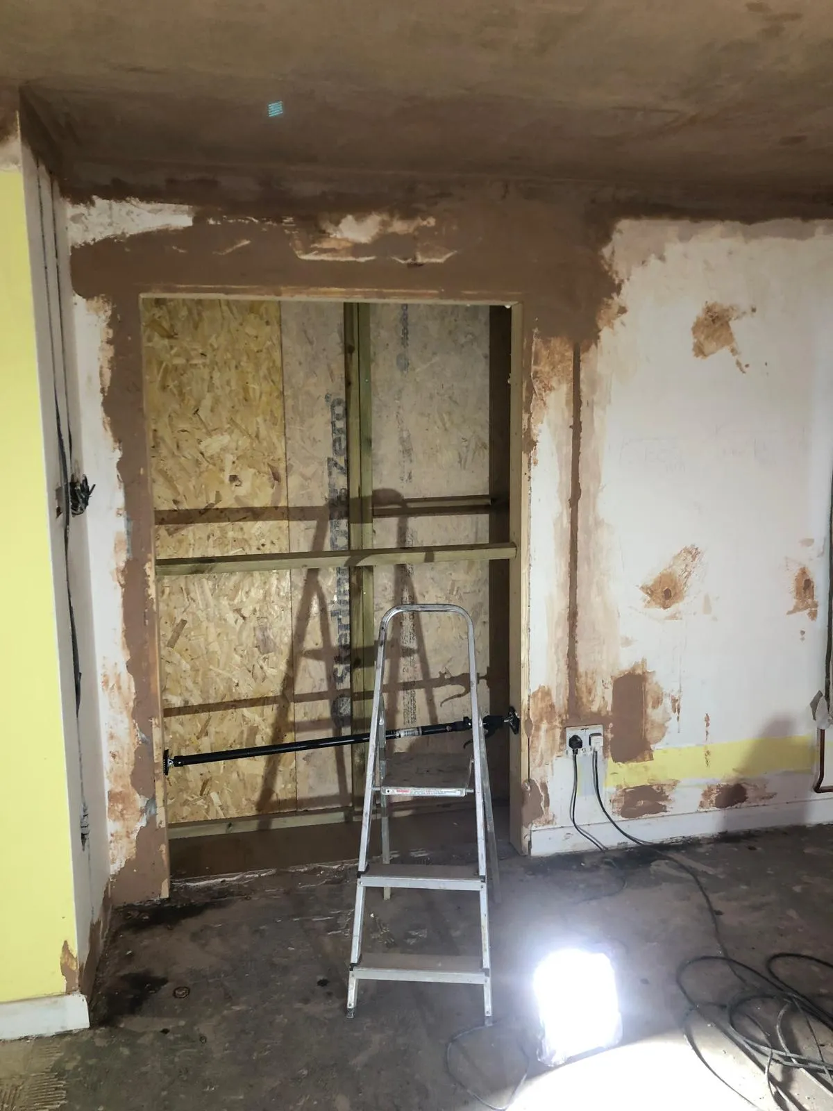 Inside stripped back, with the new opening framed in timber.