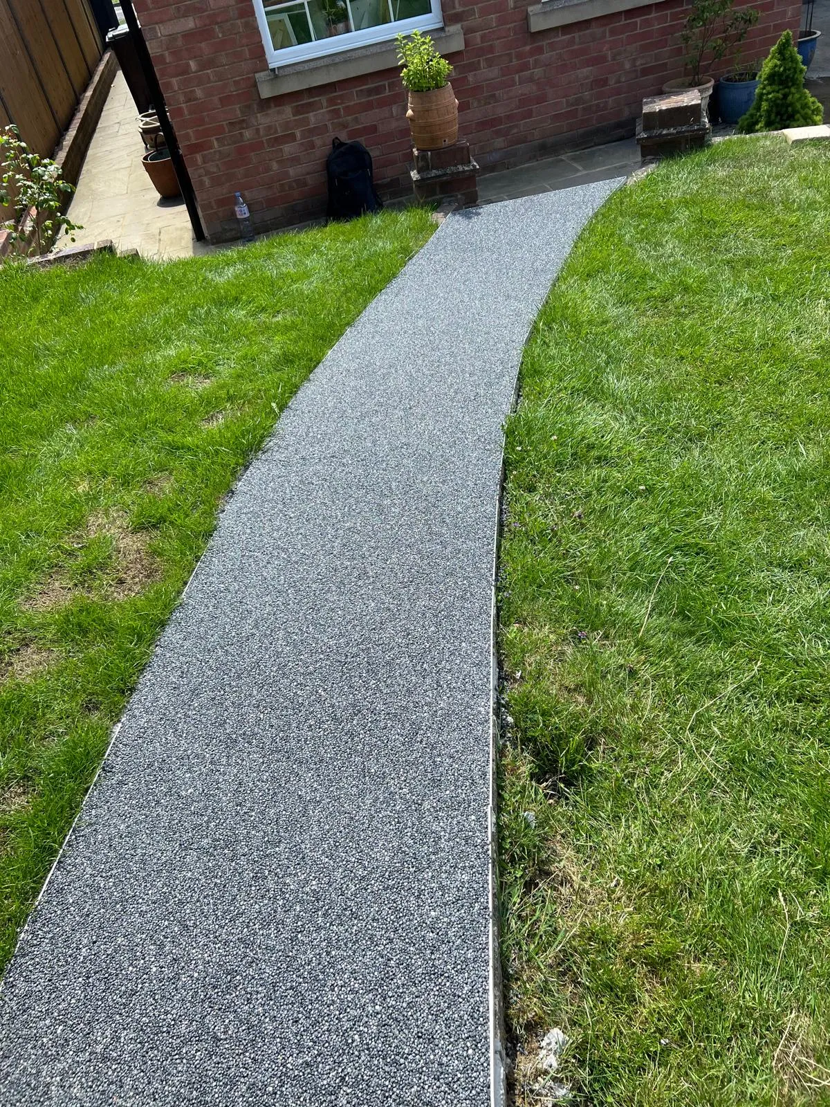 The path running across the lawn to the house.