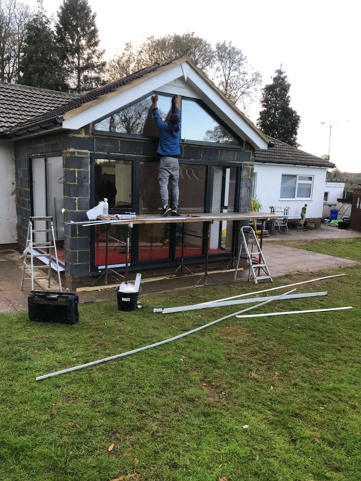 Fitting the gable glazing from a trestle.