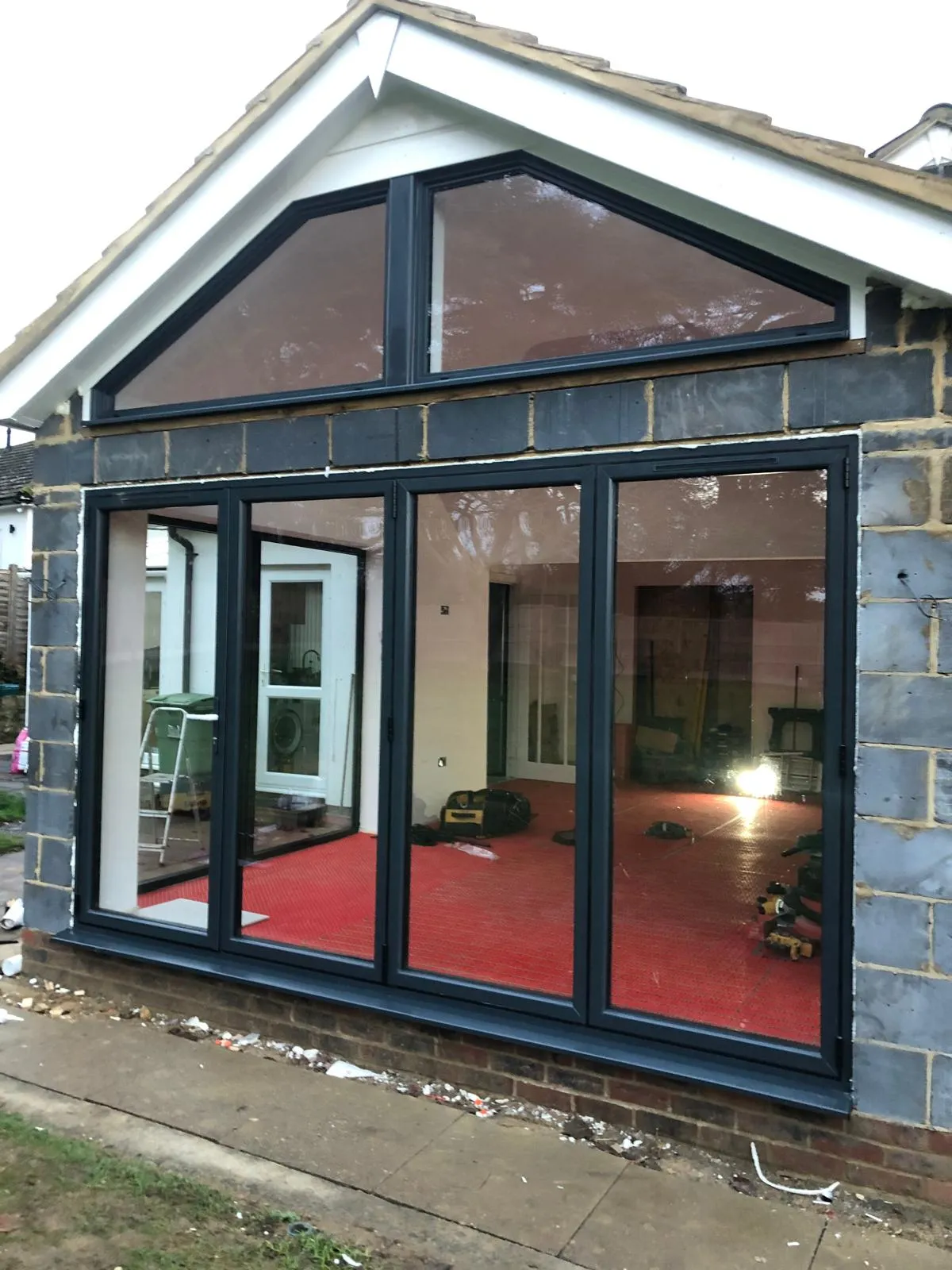 The gable and bifold doors glazed.